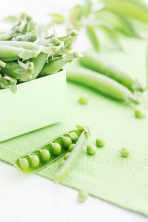 young fresh juicy pods of green peasの写真素材