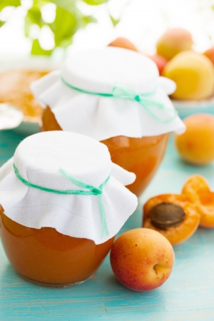 fresh apricots and apricot jamの写真素材