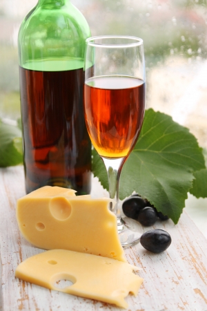 still life with wine bottle, wine glass and grapesの写真素材