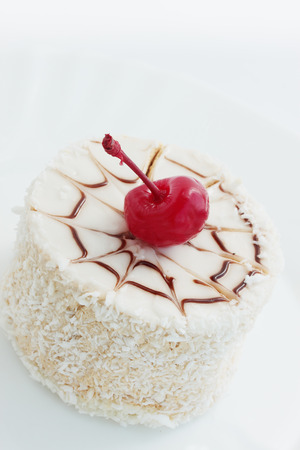  coconut cream dessert with chocolate and cherriesの写真素材