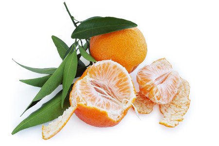 ripe tangerines with leaves isolated on white backgroundの写真素材