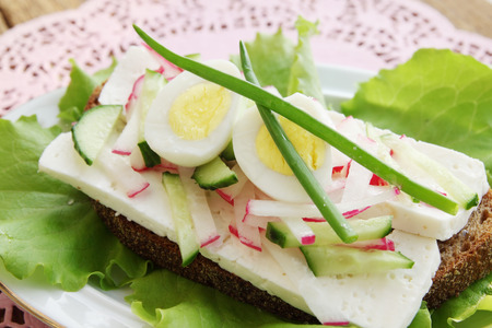 sandwich with cheese, eggs and fresh vegetablesの写真素材