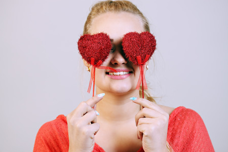 beautiful  woman closed her eyes hearts on a stickの写真素材