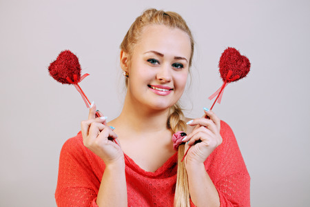 beautiful  woman closed her eyes hearts on a stick