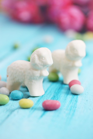 Easter  still life, lamb of white chocolate and candyの写真素材