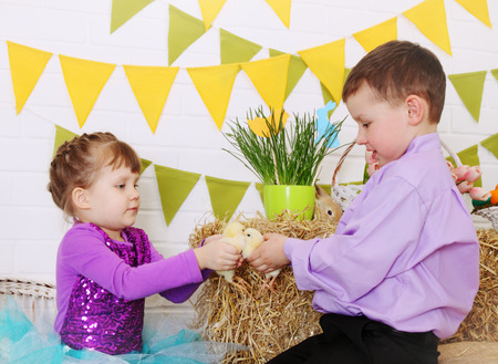 children in the interior decorations to the day of Easterの写真素材