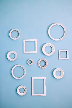 blue wall with small white framework for photoの写真素材