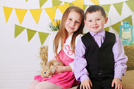 children in the interior decorations to the day of Easterの写真素材