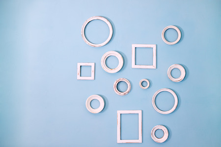 blue wall with small white framework for photoの写真素材