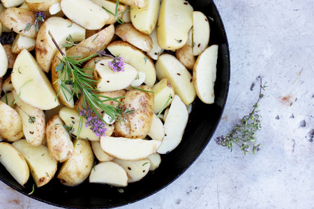Clooney young potatoes with a potato flowerの写真素材