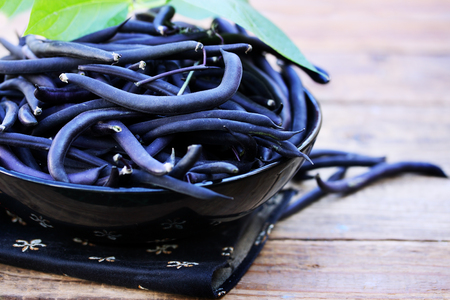 Blue asparagus beans in a large bowl