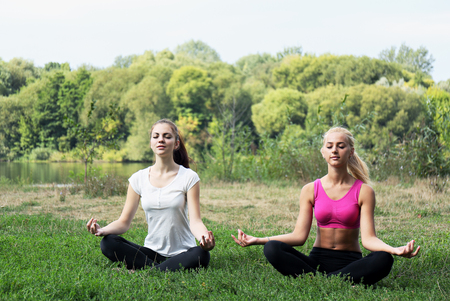 Girl in the lotus positionの写真素材