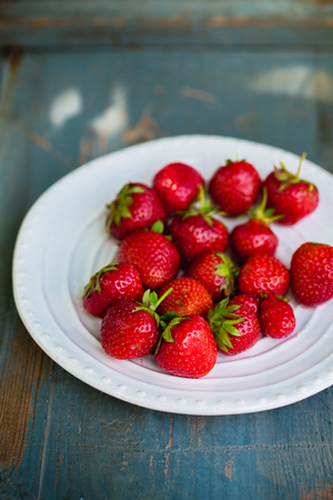 Ripe strawberries in a plate, rusticの写真素材