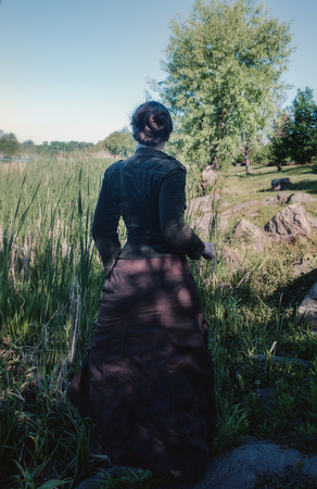 A woman runs along the swampの写真素材