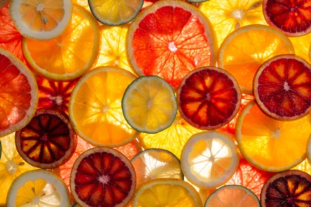 beautiful fresh sliced mixed citrus fruitsの写真素材