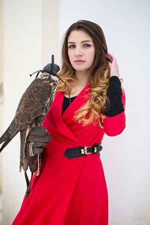 Beautiful woman with a bird