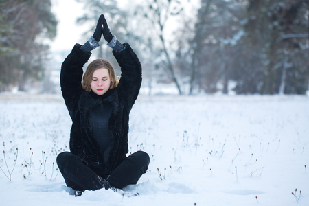 woman meditating in the parkの写真素材