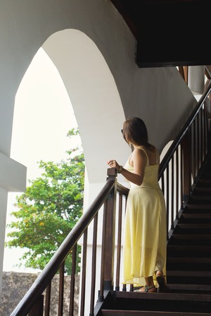A woman standing on staircaseの写真素材