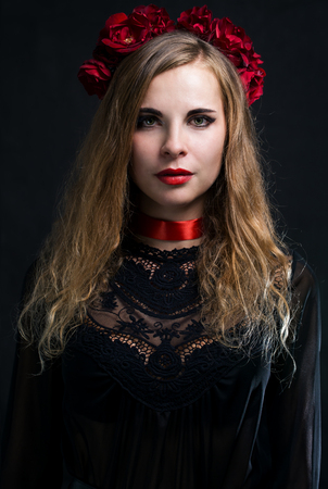 Woman with a rose wreathの写真素材