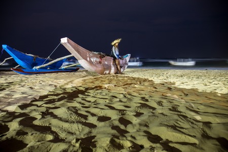 The girl near the boatの写真素材