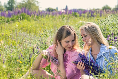 Two friends rest on the fieldの写真素材