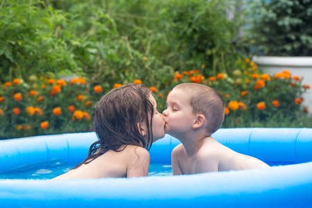 Brother and sister are kissingの写真素材