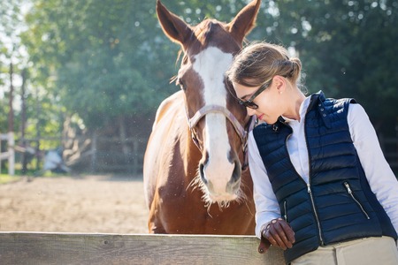 Portrait of a woman and horseの写真素材