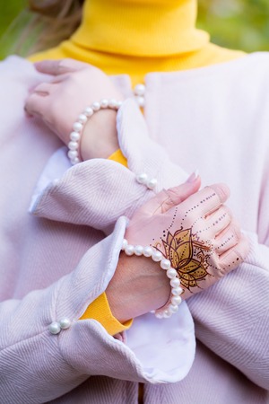 gently pink gloves with pearls and paintingの写真素材