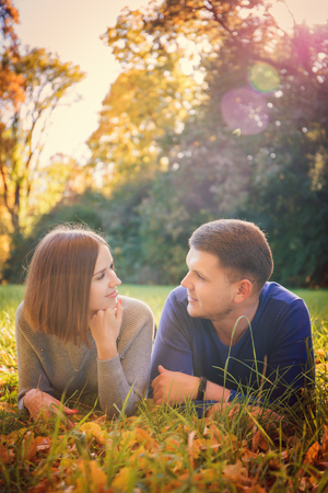 Young couple is lying on the meadowの写真素材