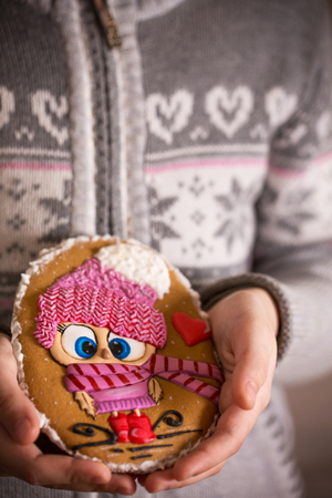 Gingerbread in childrens handsの写真素材