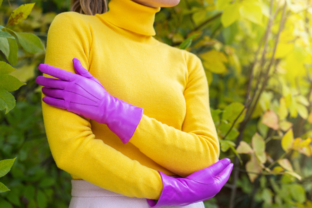 Woman in a bright glovesの写真素材