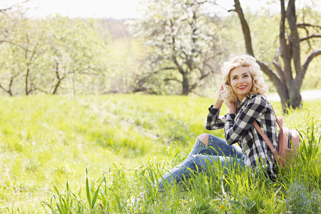Beautiful girl resting on the grassの写真素材