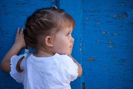 Little girl playing hide and seekの写真素材
