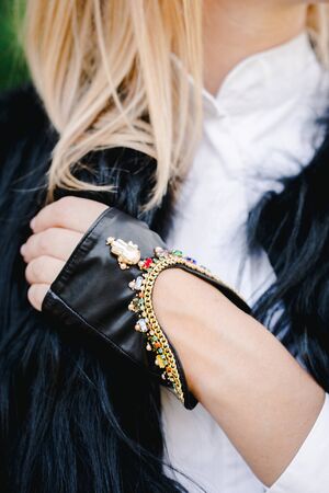 Black short gloves with a chain, stones and an amulet of Hamsa, Hand of Fatimaの写真素材