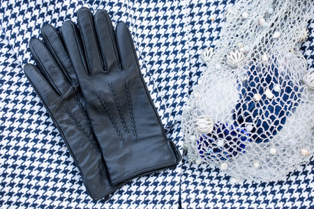 Glamorous still life jacket, gloves and string bag