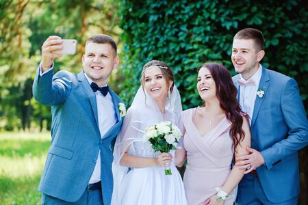 Friends of the bride and groom take a selfieの写真素材