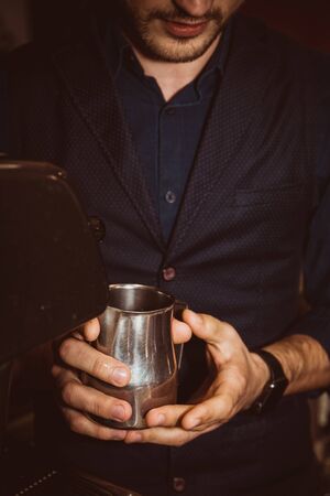 Barista makes cappuccino in a cafe. Tintedの写真素材