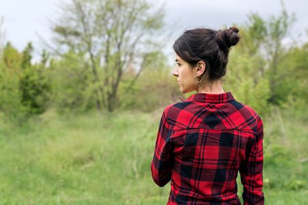 A young girl with a hair horns goes on the meadowの写真素材