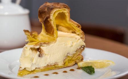 Cake on Choux pastry with lemon cream in a cafe