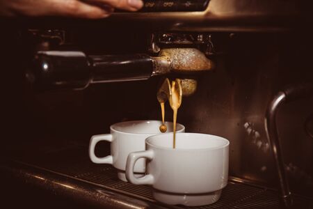 Aromatic coffee is prepared in the coffee machineの写真素材