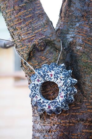 Two garlands of seeds for birds on a treeの写真素材