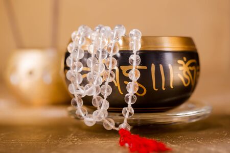 singing bowl and crystal beads for healing in reiki flowの写真素材