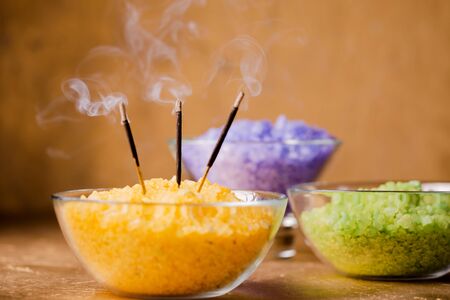 incense sticks and sea salt for a session of energy cleansing legs in a stream of reikiの写真素材