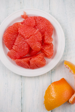 Juicy delicious ripe grapefruit on a plateの写真素材