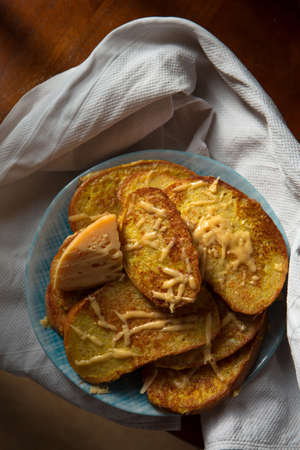 Croutons fried in egg with cheese. Still life in rustic styleの写真素材
