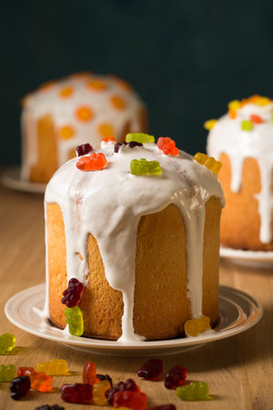 Easter cakes decorated with candied fruits and jelly eggs, close-up