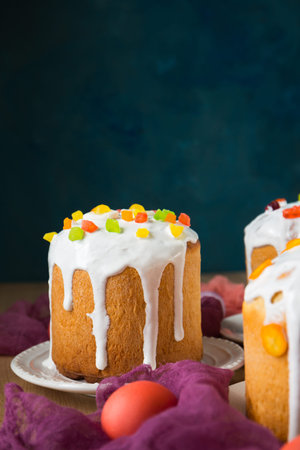 Easter cakes decorated with candied fruits and jelly sweets and kumquat