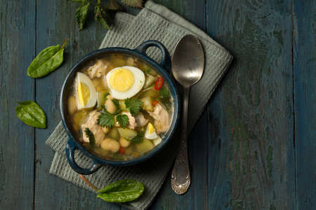 Green borsch with sorrel, nettle and eggsの写真素材