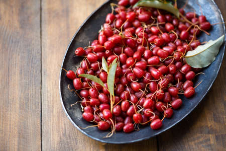 Ripe delicious sweet Gumi berries in a metal antique treyの写真素材