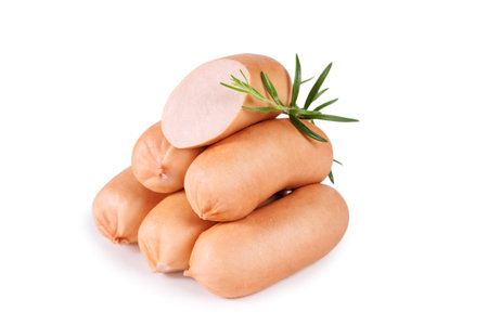 Delicious sausages with a sprig of rosemary isolated on white backgroundの写真素材